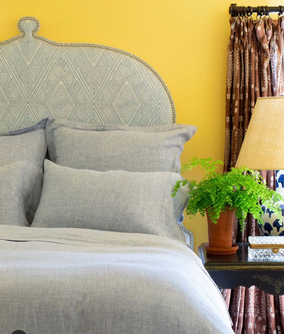 Image of yellow wall in bedroom referenced in Atlas Concorde USA blog from John Robshaw